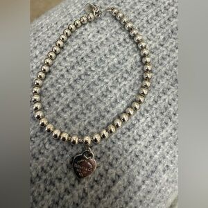 Return to Tiffany®
Heart Tag Bead Bracelet in Silver - gently used.